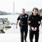 olympian charged for mall damage
